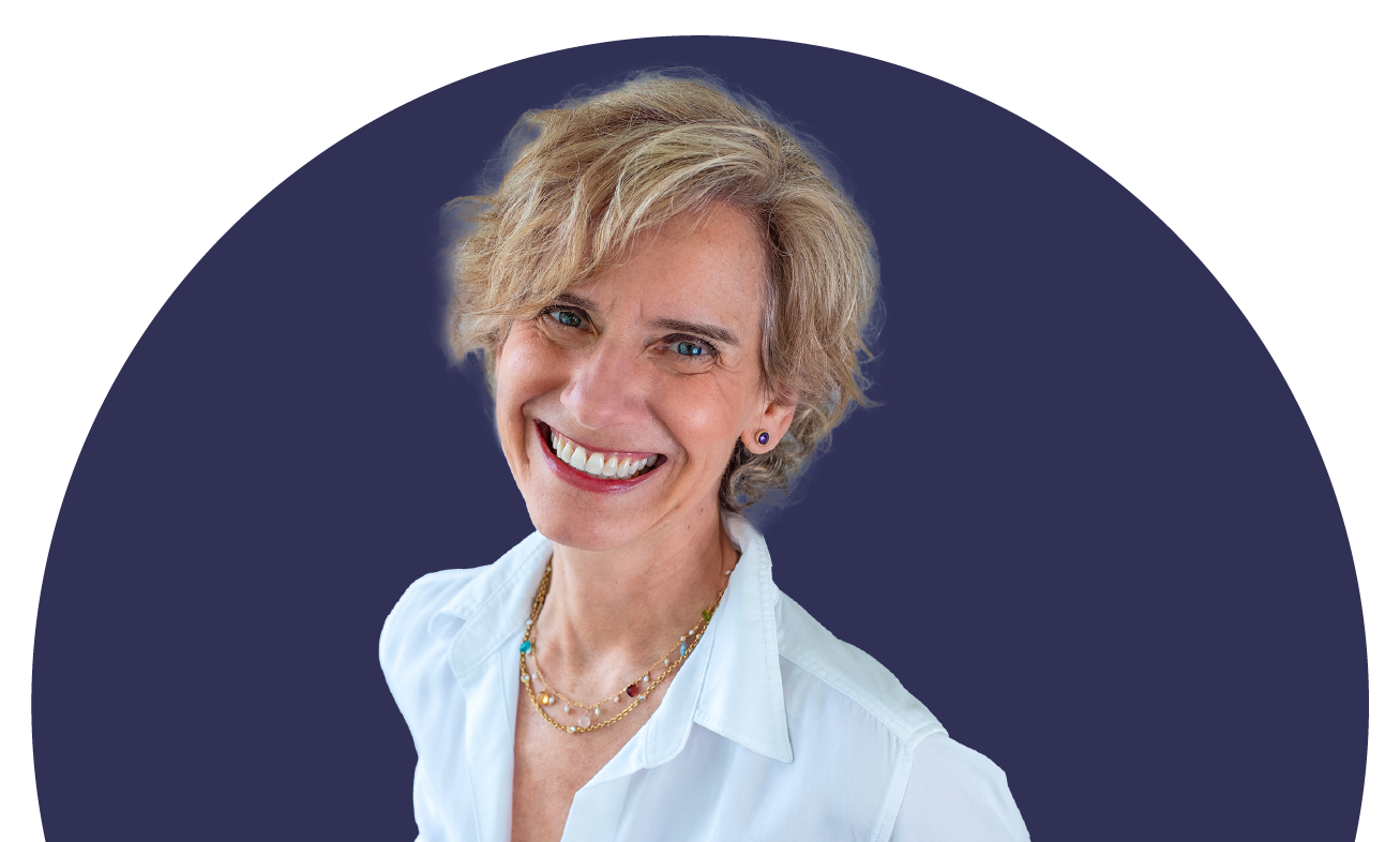 A woman with short blonde hair is wearing a white collared shirt and is smiling.