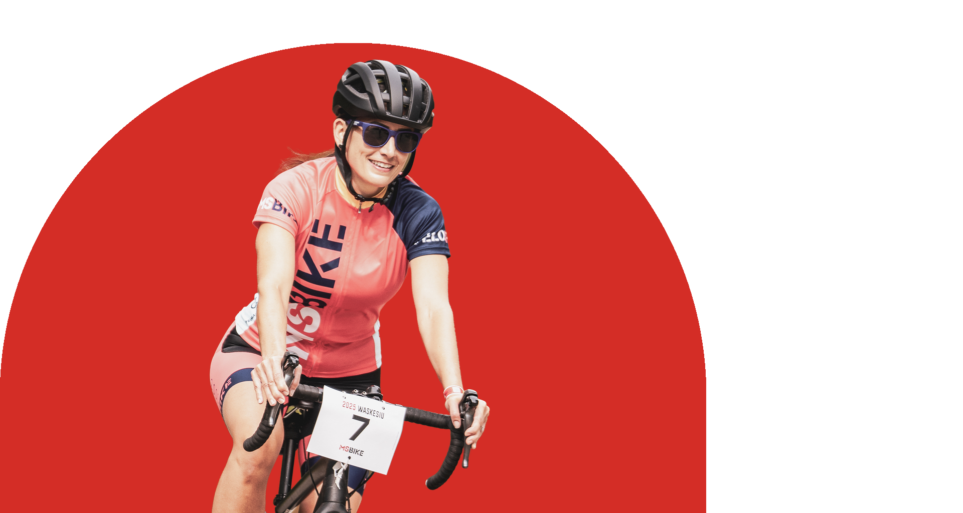 Female cyclist in red jersey and helmet riding a bike, red circle background.